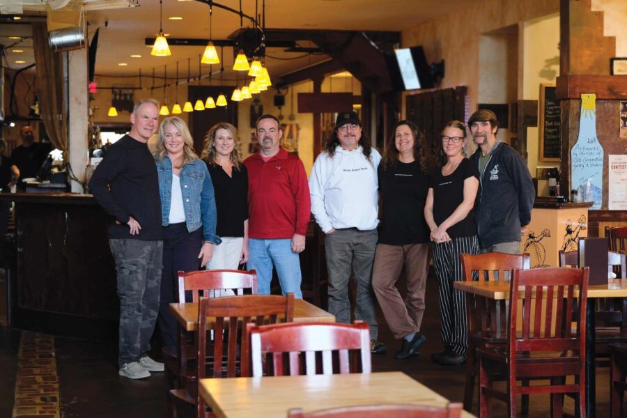 The past and current set of 4 couples that have owned Outer Banks Brewing Station